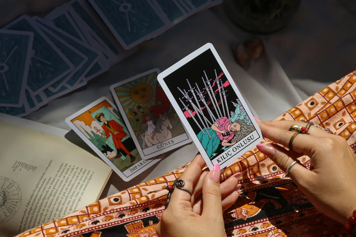 A woman is holding an electronic device in her hands - best online psychic readings