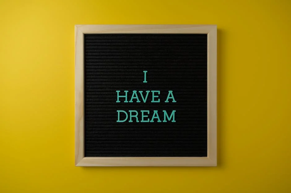 Close-up view of a letter board with 'I Have a Dream' message on a vibrant yellow background. - dream analysis experts online