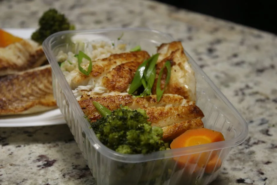 Delicious grilled chicken with broccoli and carrots in a meal prep container. Perfect for healthy eating. - portion control