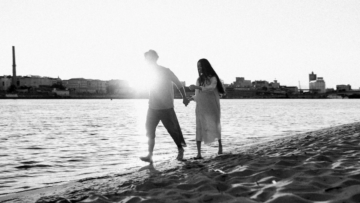 man and woman kissing on beach - couple love together - Relationship advice psychics
