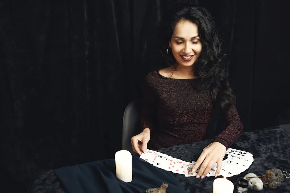 Woman smiling while doing tarot reading with candles and crystals. Perfect for spirituality themes. - trusted tarot readers online